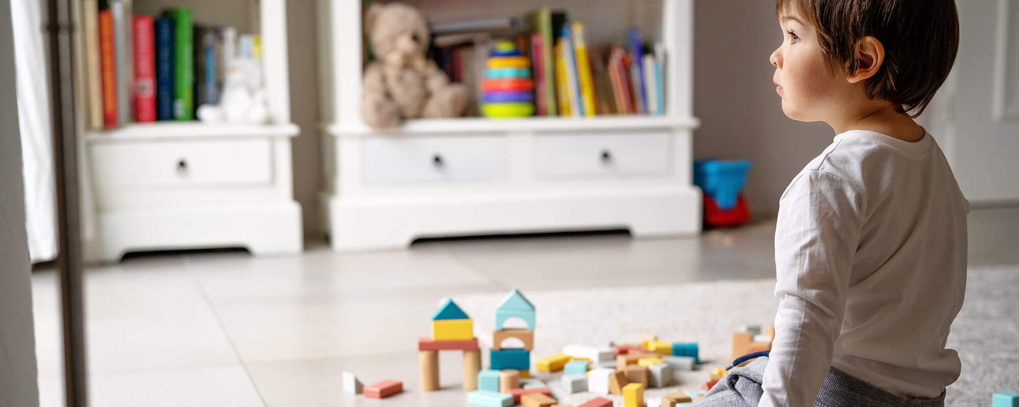 A boy plays with blocks.